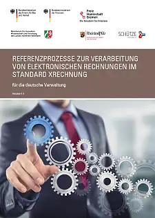 Ein Mann im Anzug der mit dem Finger an einem blauen Rädchen dreht